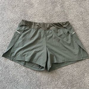 Avia XL olive green workout shorts with built in biker shorts and split hem